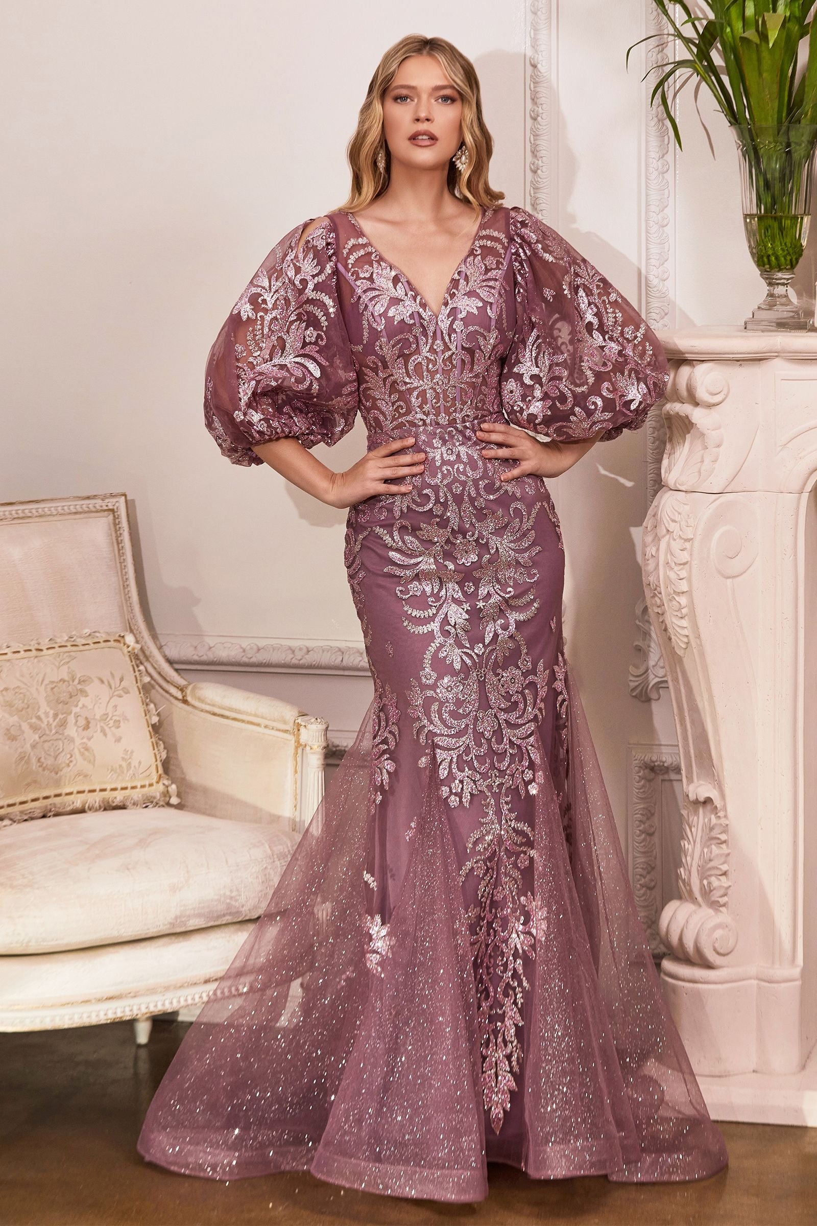 A show-stopping glittering mermaid gown, featuring elegant long sleeves