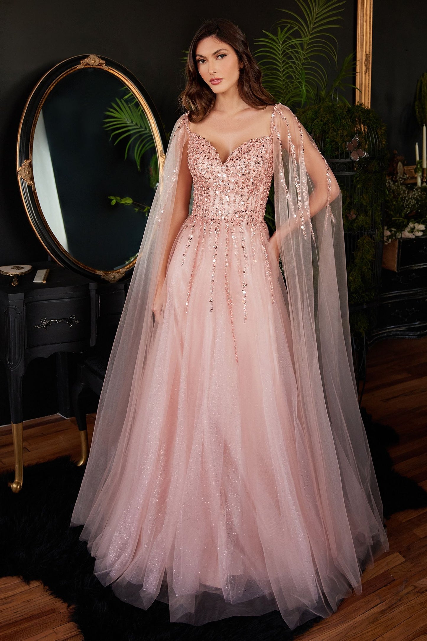 Blush pink elegant gown with a flattering V-neckline and a beautifully draped skirt.