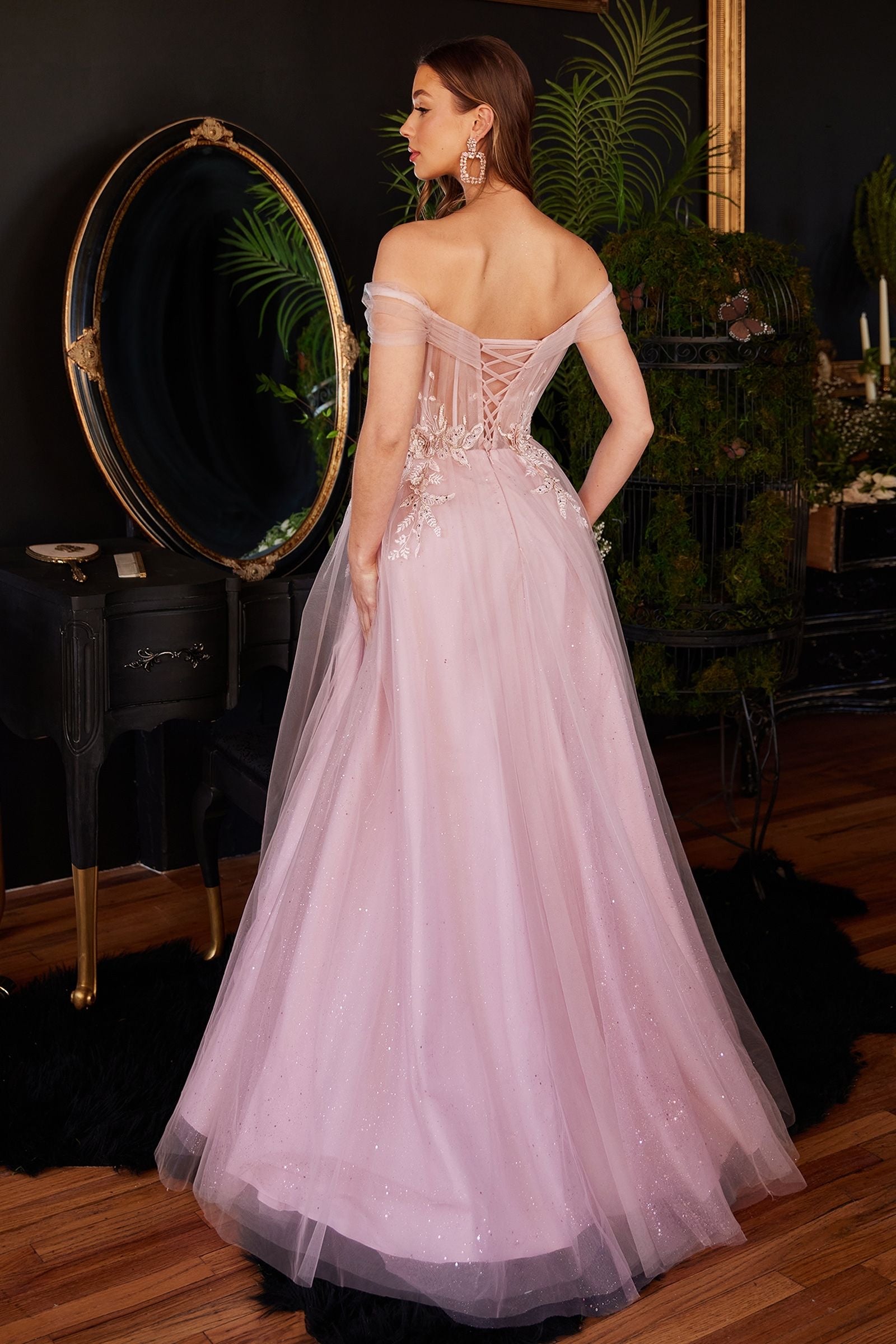 princess style pink wedding ball gown with a corset bodice and intricate lace appliques