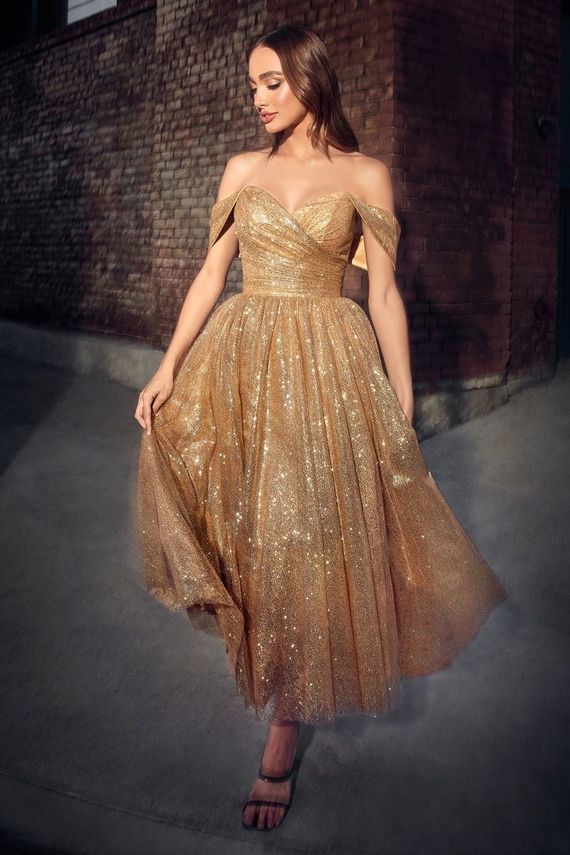 gold Sweetheart romantic fairy prom dress gown with glittered fabric with bodice corset with volume to the skirt. 