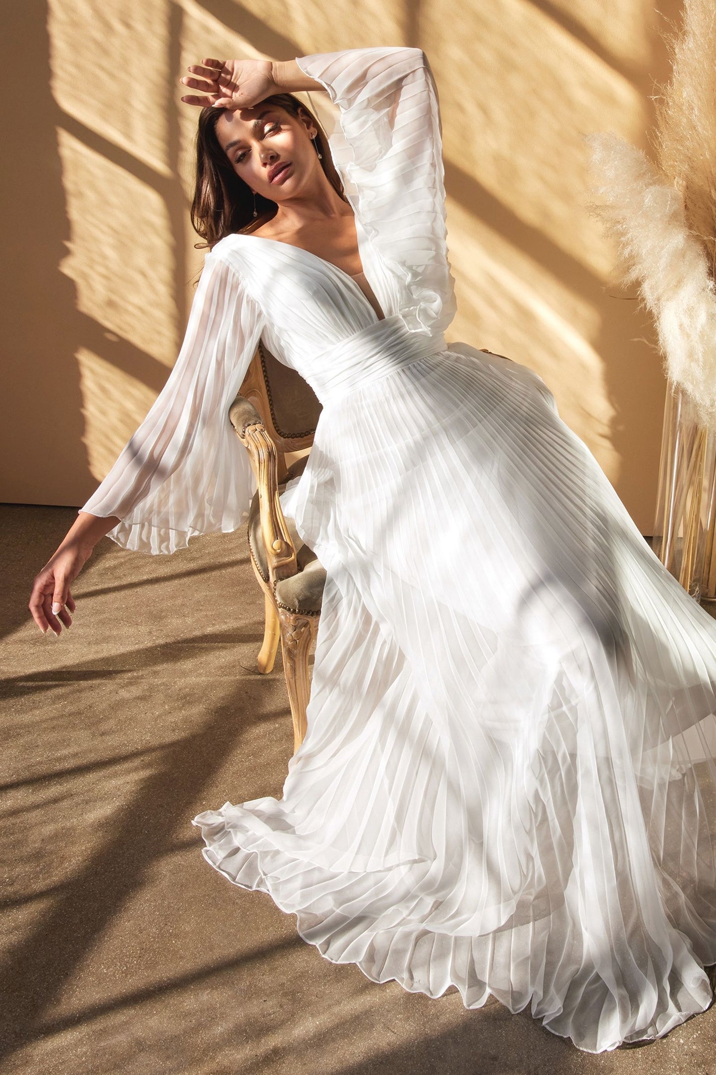 Romantic chiffon gown with a deep V-neckline and gathered waist for a flattering and ethereal look vivienne westwood