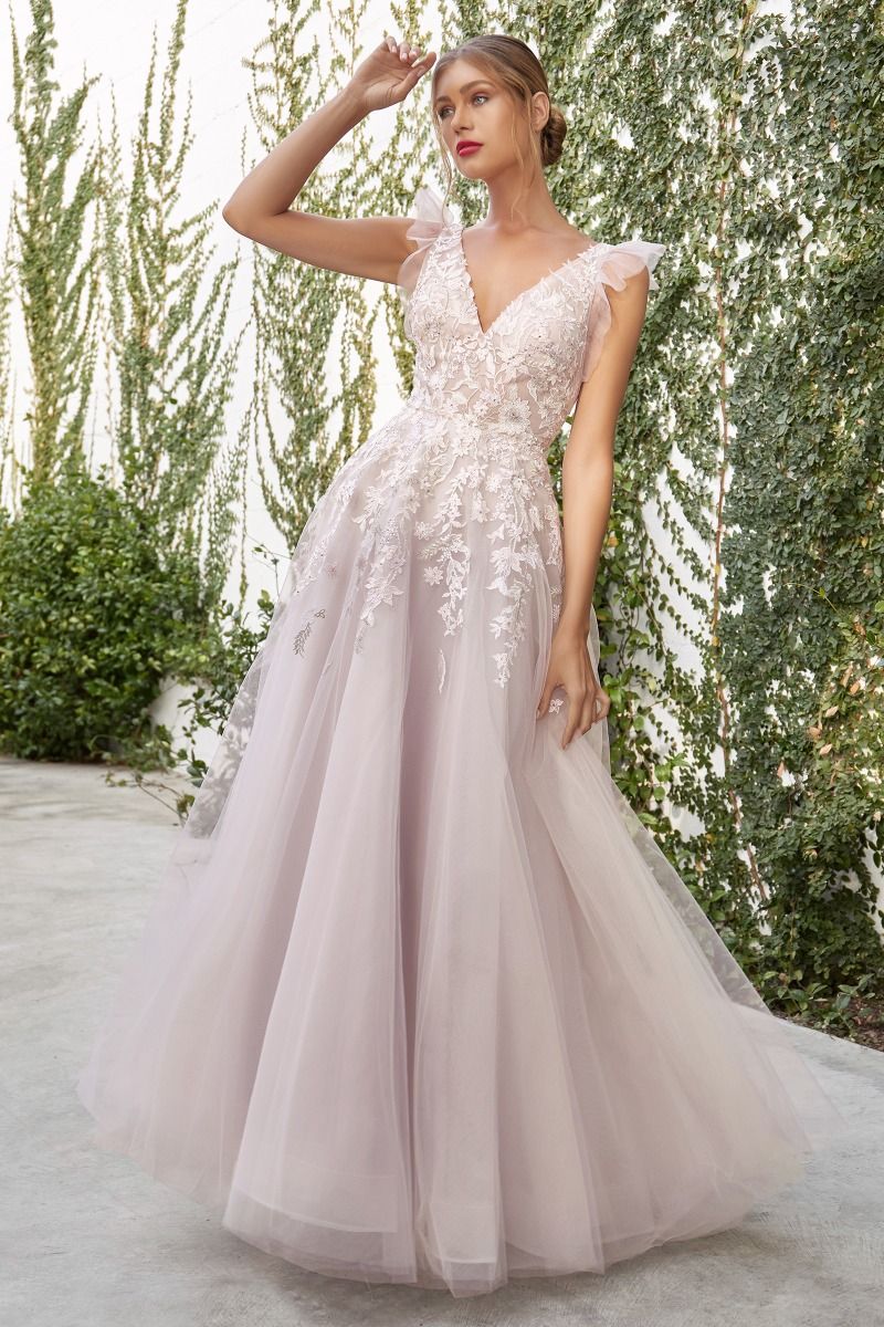 Light blush wedding dress with intricate lace and beading details