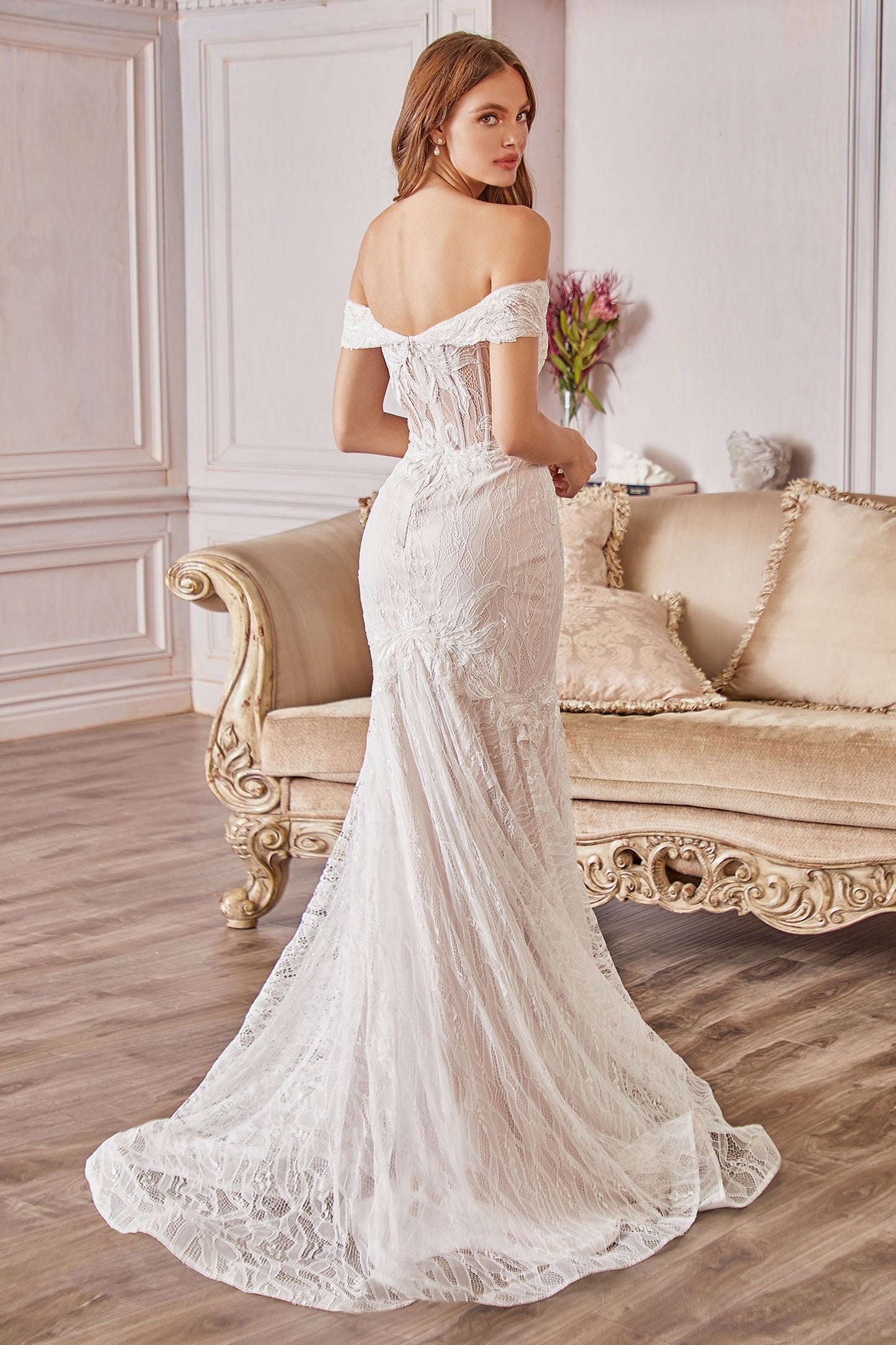 a modern mermaid style wedding dress with an off the shoulder neckline vivienne westwood