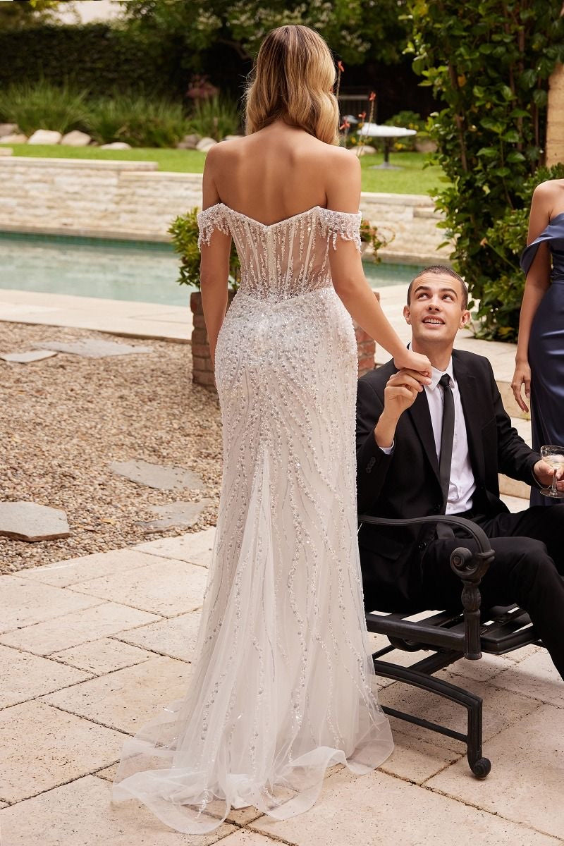 stunning off the shoulder wedding dress featuring a sequin embellished bodice and a flowing a-line silhouette