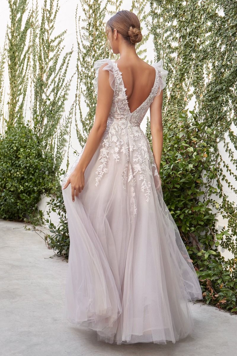 A-Line wedding gown in light blush with delicate ruffled shoulder detail.