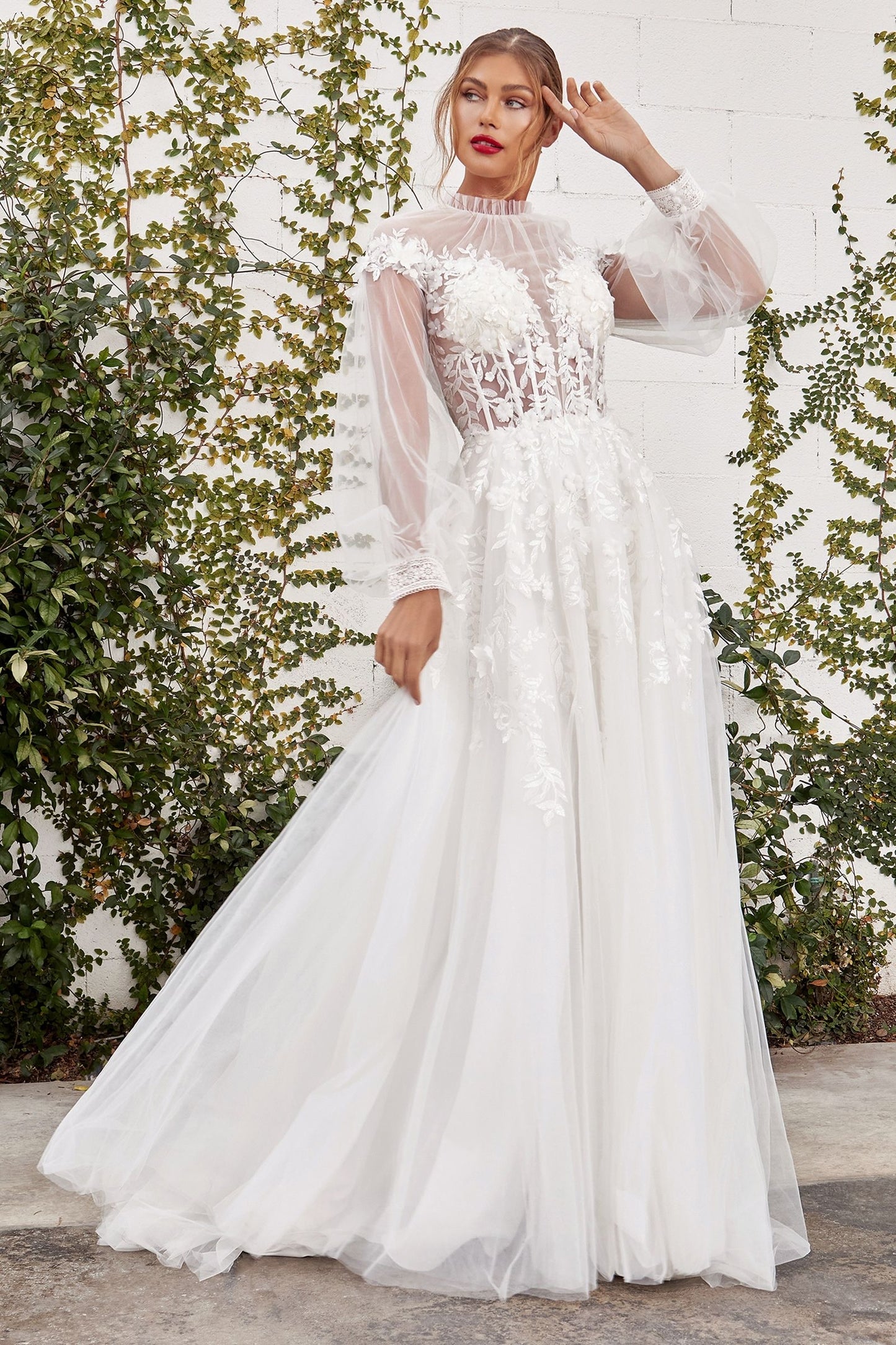 bridal buttons adorn the sheer tulle back of the gown