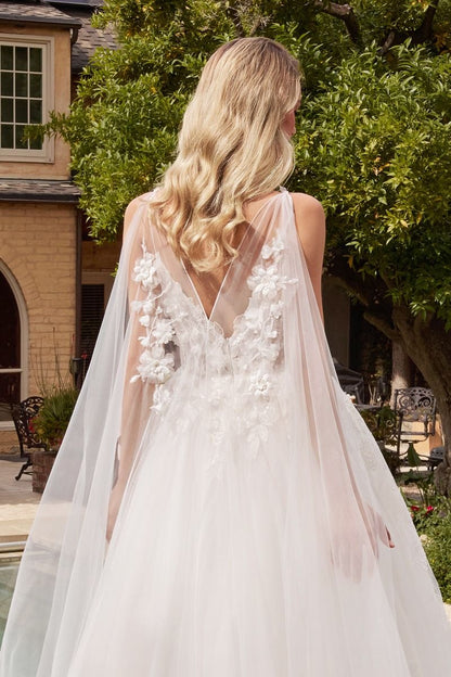 Stunning floral wedding ball gown featuring layered tulle and a sheer bodice with a sweetheart neckline