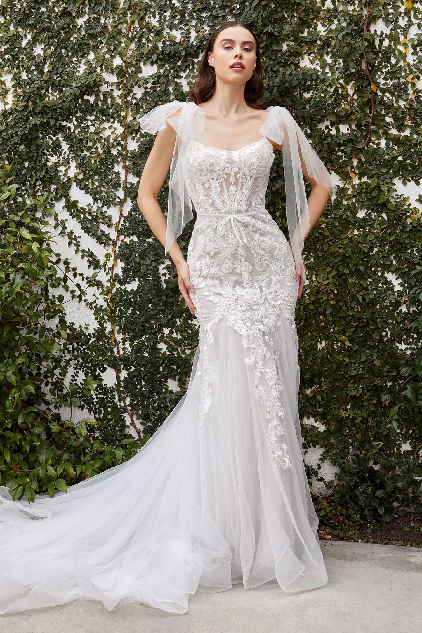 Playful lace gown with detachable tulle ribbons that can be tied delicately around the straps