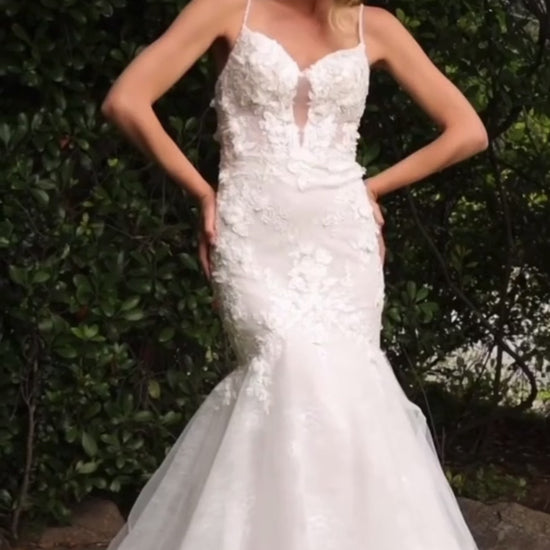 Glamorous lace mermaid wedding dress with dimensional floral applique and a subtle open back silhouette