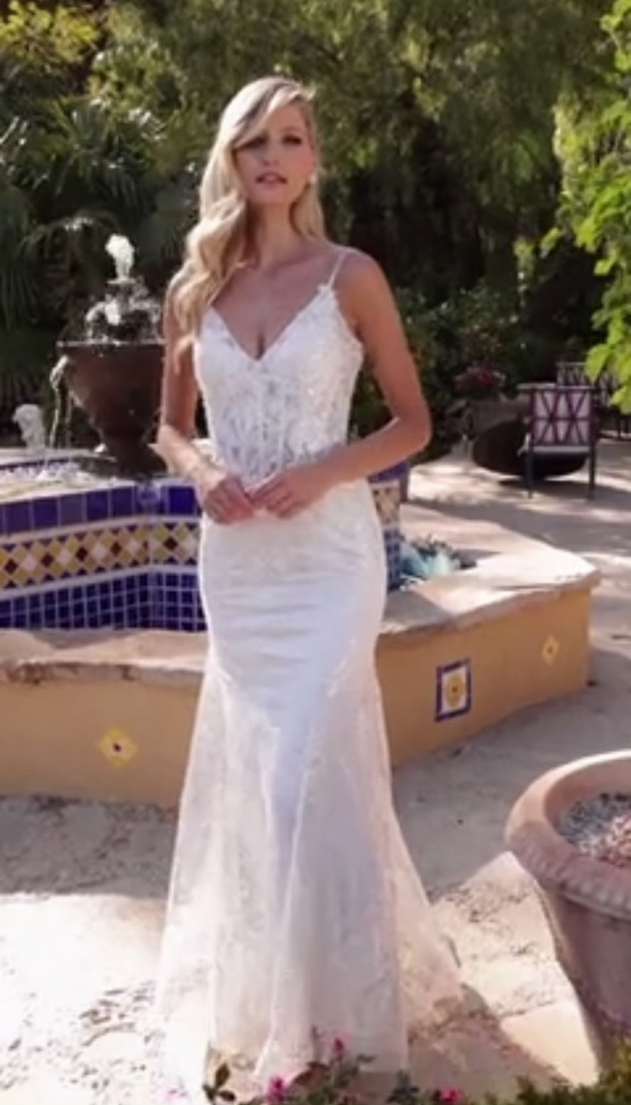 modest v neckline and narrow spaghetti straps for an elegant touch