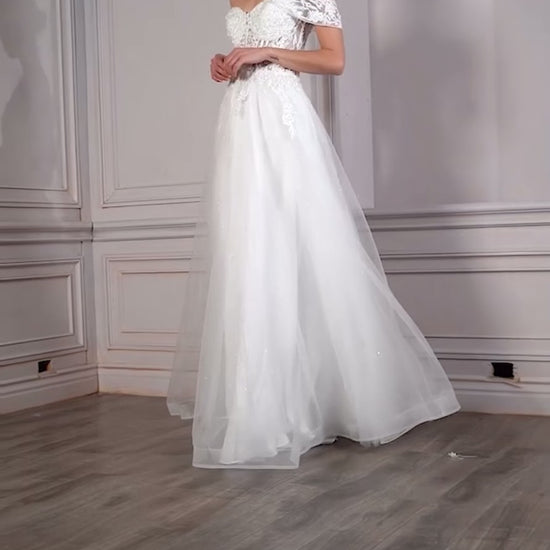 feel like a princess in this beautiful gown with layers of tulle and floral lace applique