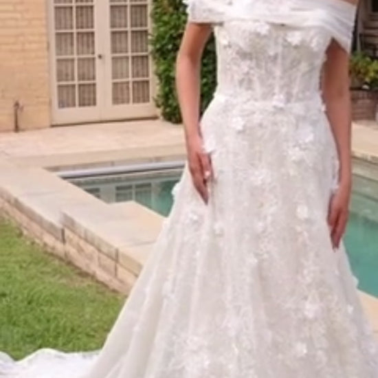 Magical ball gown wedding dress with layered lace fabrication and intricate detailing