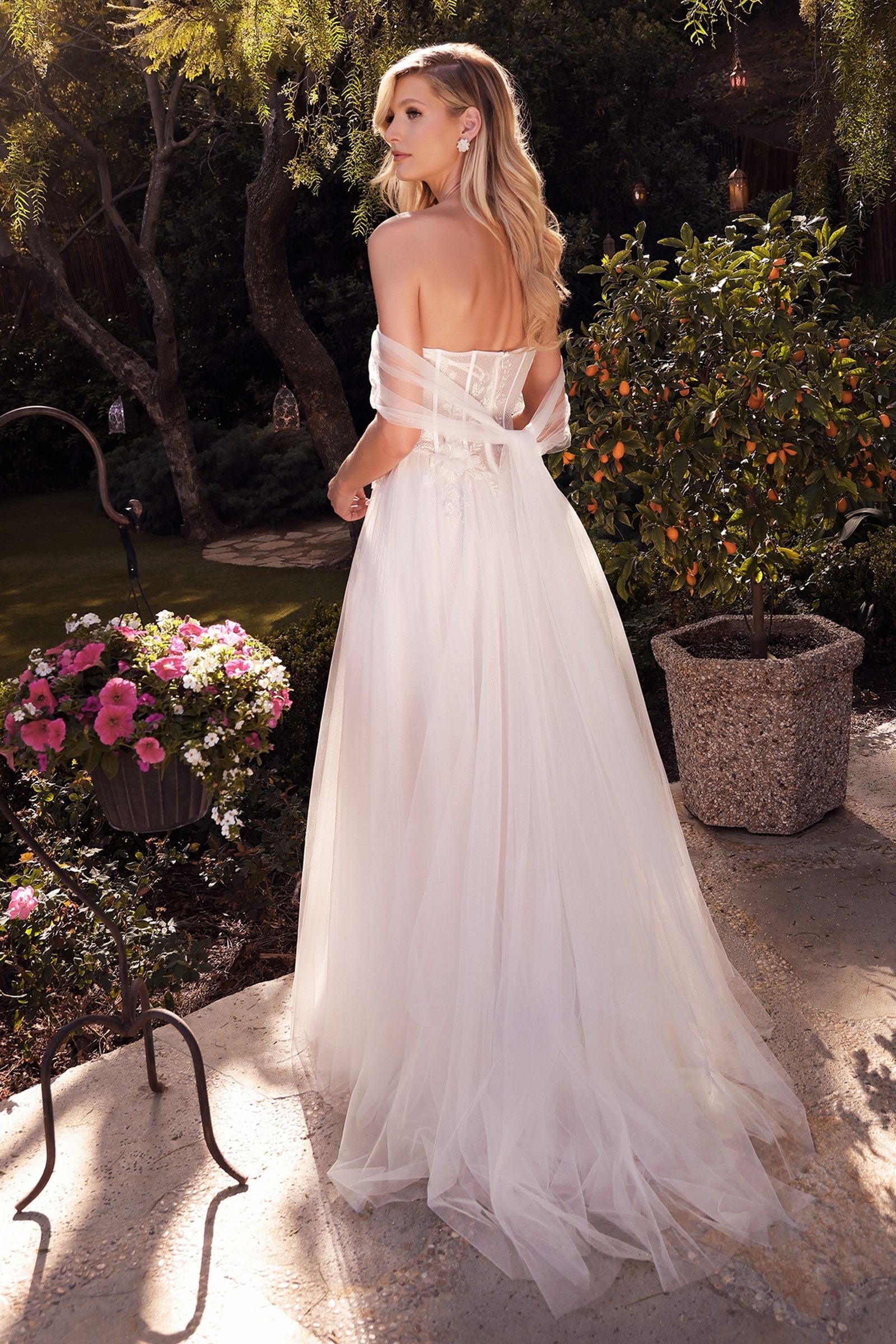 Elegant wedding dress with a corset bodice and sparkling glitter appliqué