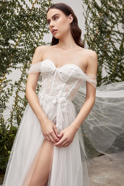 Romantic dress featuring a tie-back cape and delicate organza floral embellishments