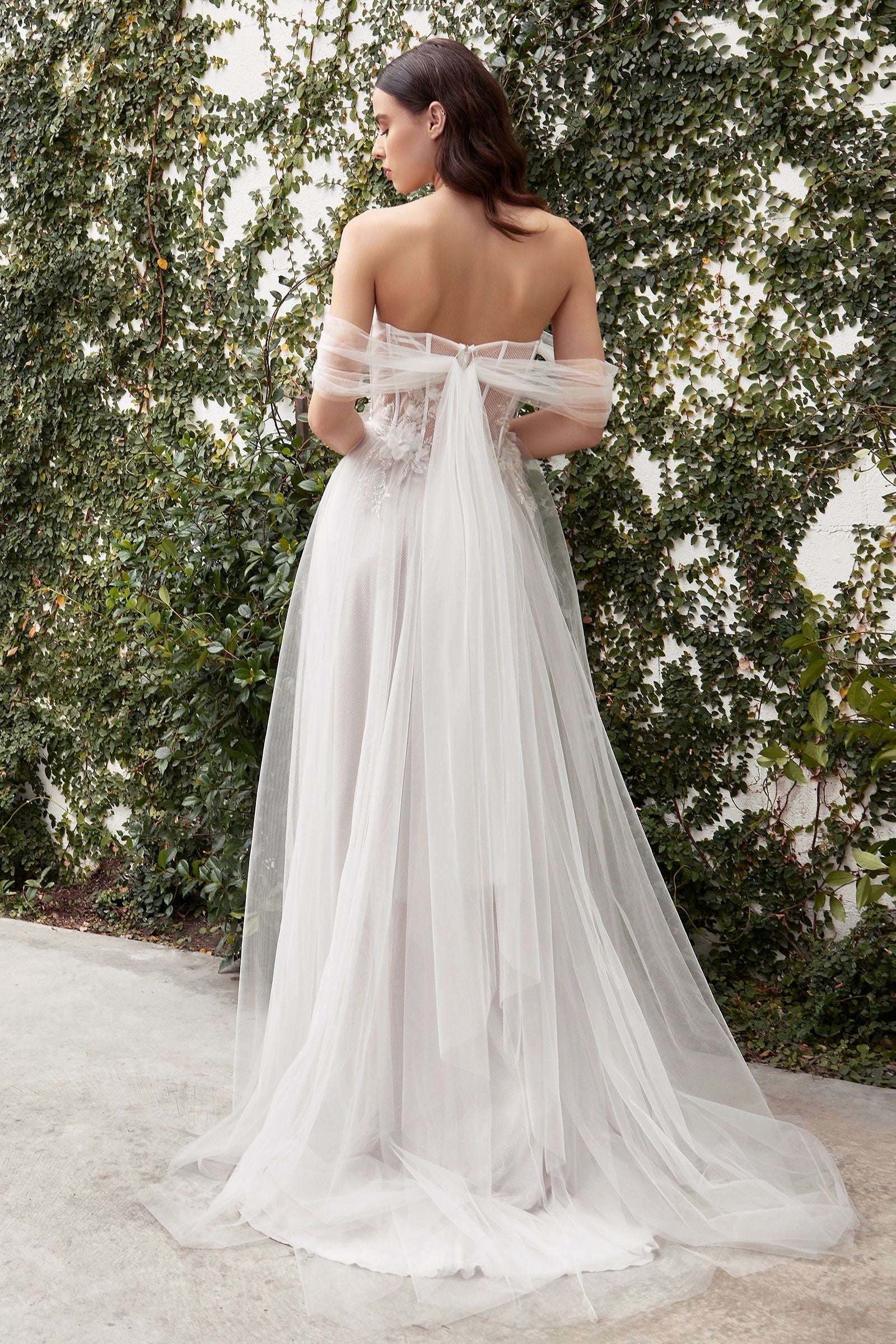 Dramatic bridal gown with a glittering corset bodice and soft tulle skirt