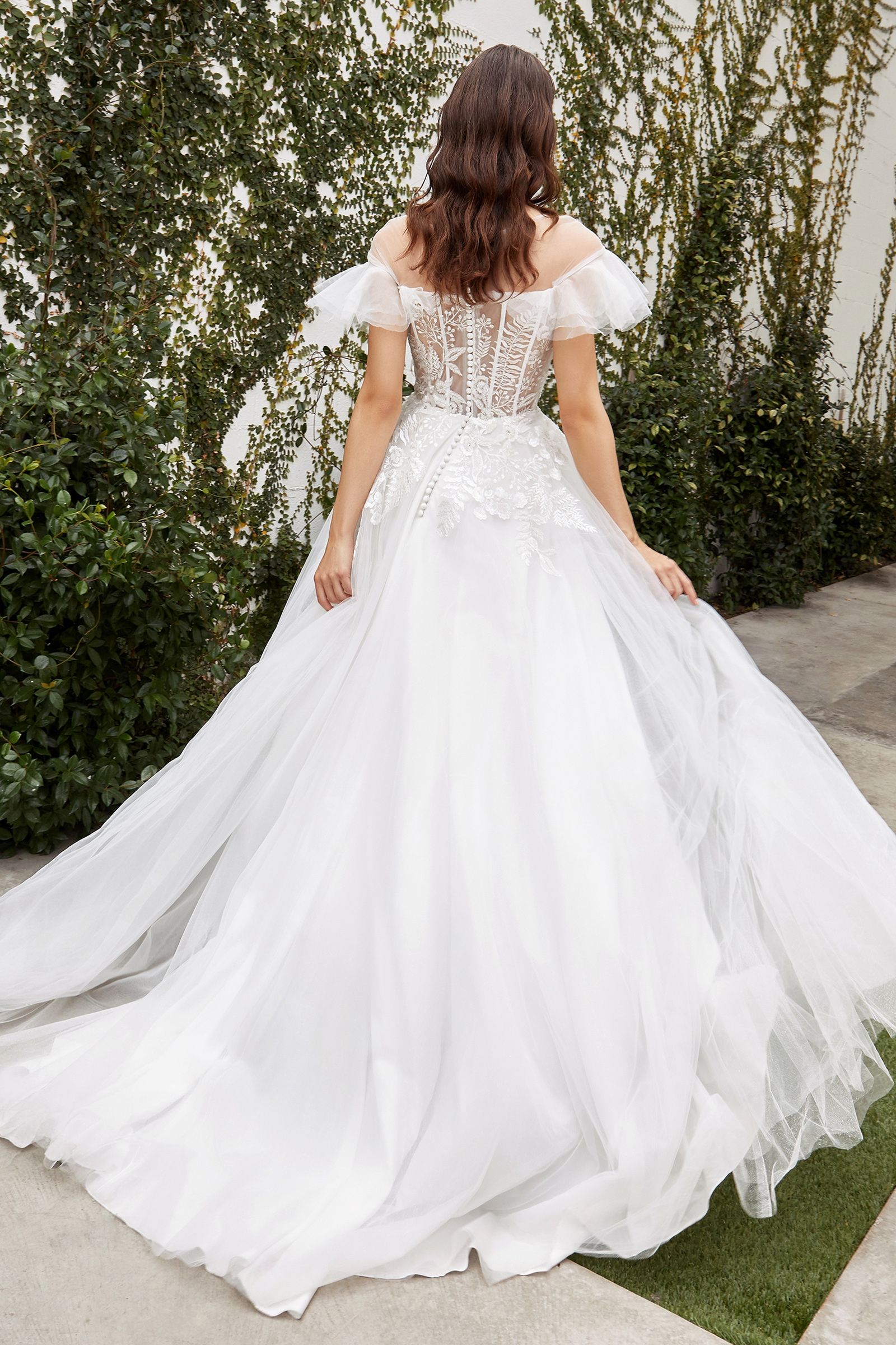 Sumptuous gathered tulle bridal gown with a flattering silhouette and sheer boned corset for extra support