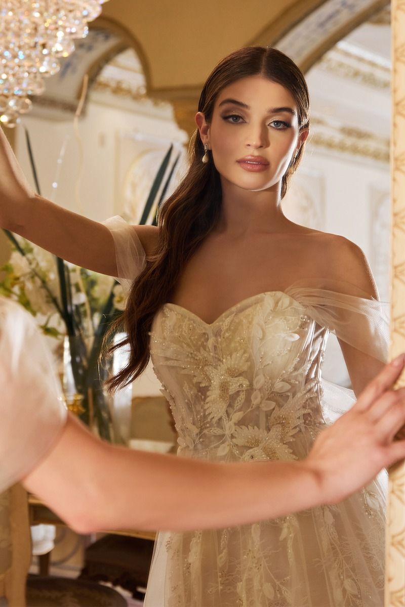 Whimsical wedding dress adorned with glass-bead birds and 3D leaf details for a touch of enchantment