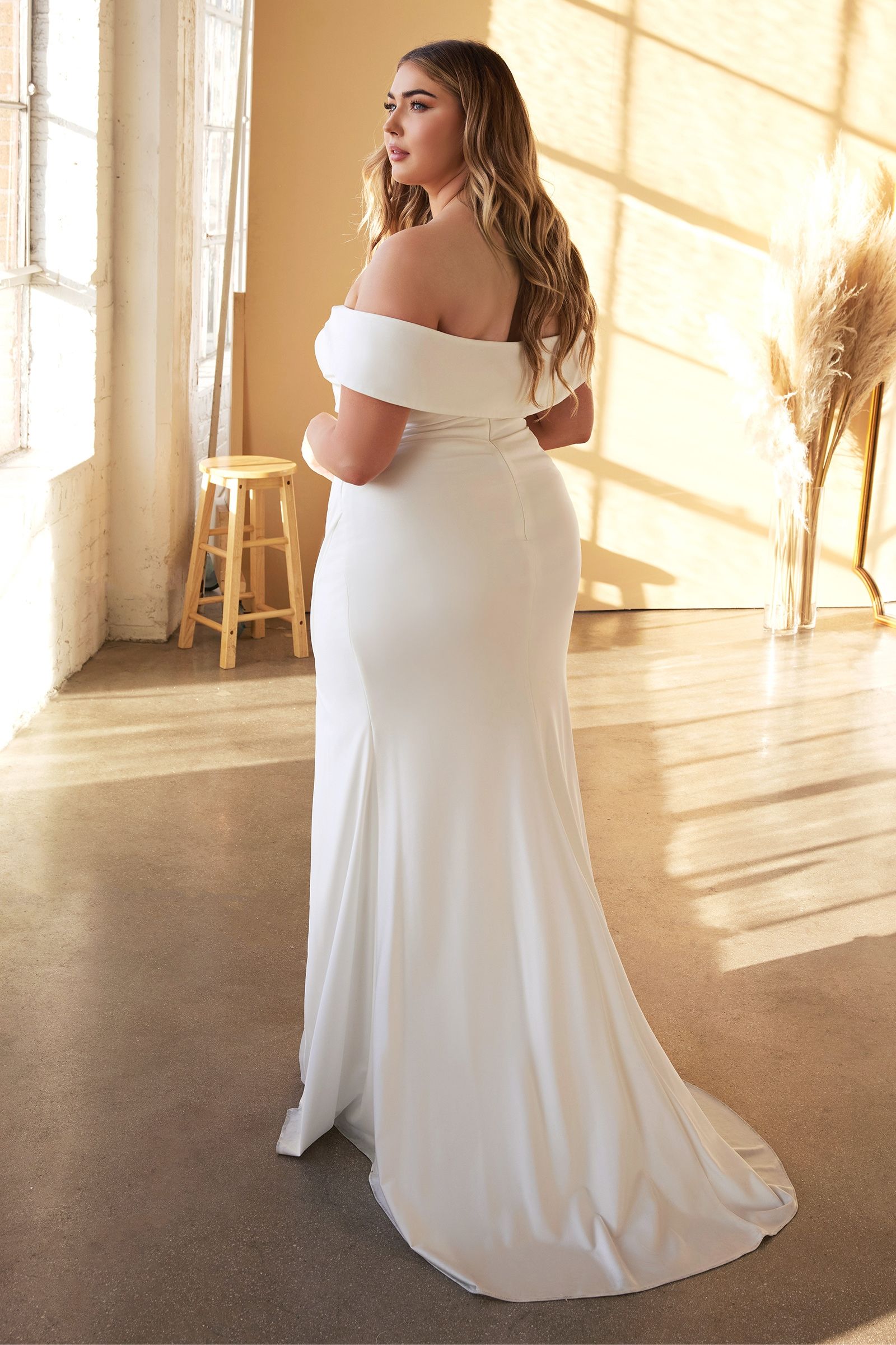 Romantic off-white stretch satin bridal gown with off-the-shoulder straps and ruching at the waist