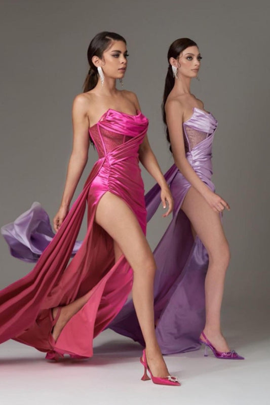 Elegant satin gown with a strapless pleated neckline and a flowing silhouette.