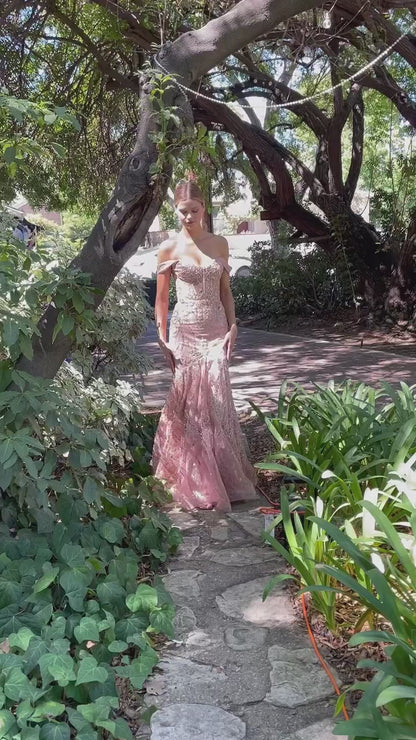 pink blush fitted gown with an off-the-shoulder neckline and a voluminous hem