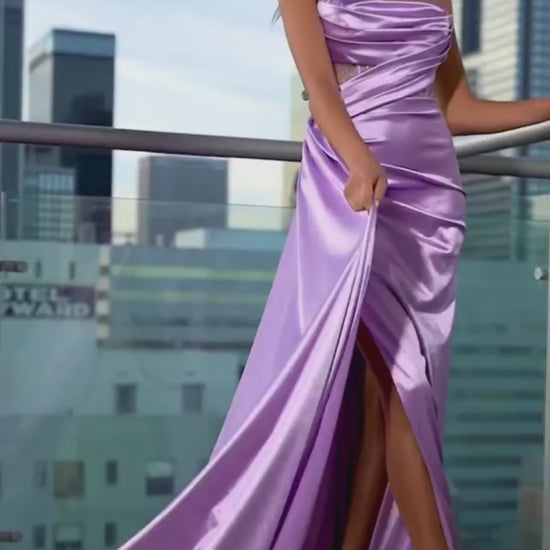 purple Striking satin gown with a draping bodice and a pleated skirt.