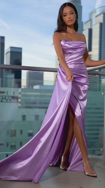 purple Striking satin gown with a draping bodice and a pleated skirt.